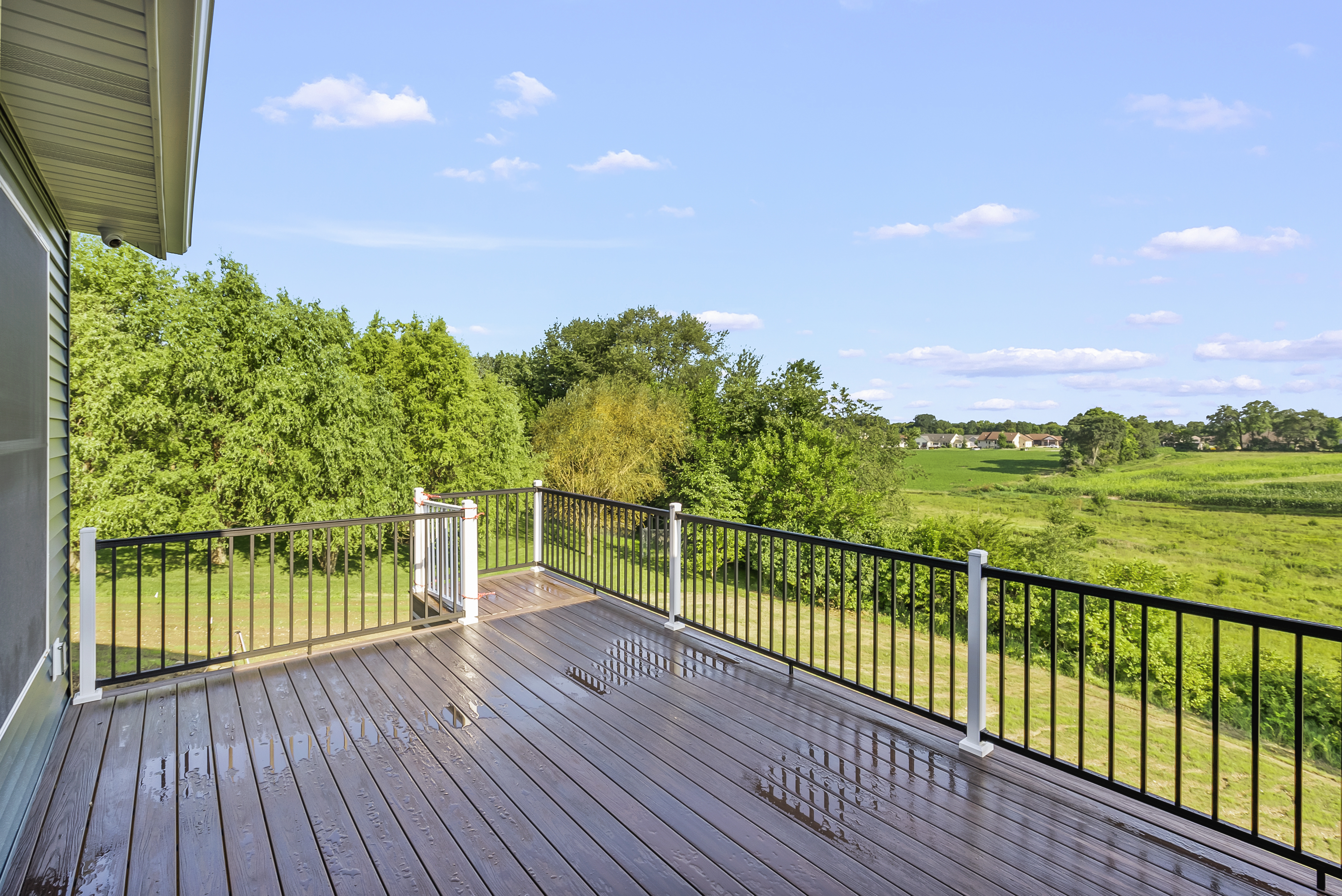 Covered deck with metal railings