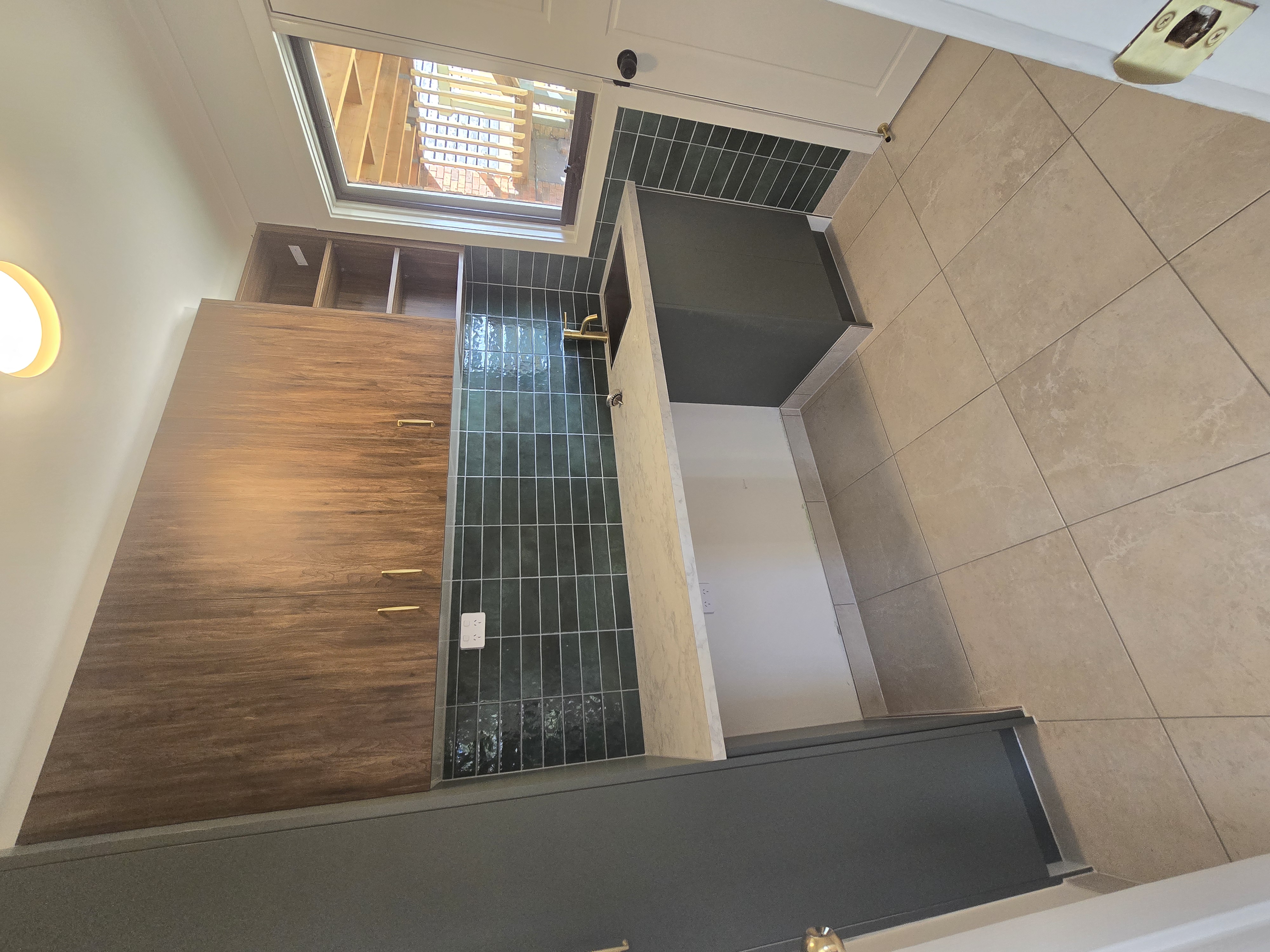 Manor Lakes — renovated kitchen with green tile backsplash and timber cabinetry