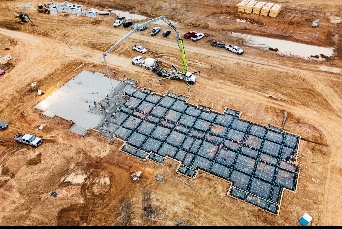 Commercial concrete parking lot pour by Onyx & Iron Construction in North Texas